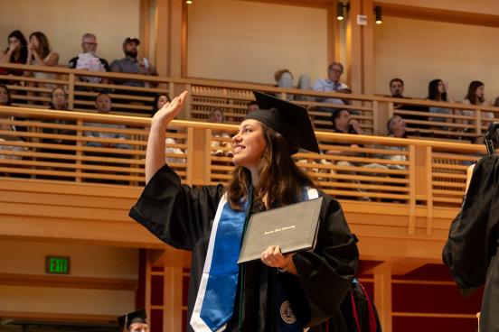 ssu graduate waving from stage