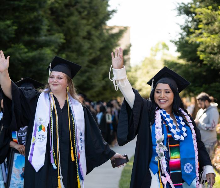 Students waving at their families