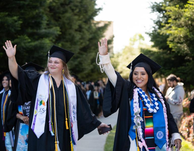 Students waving at their families