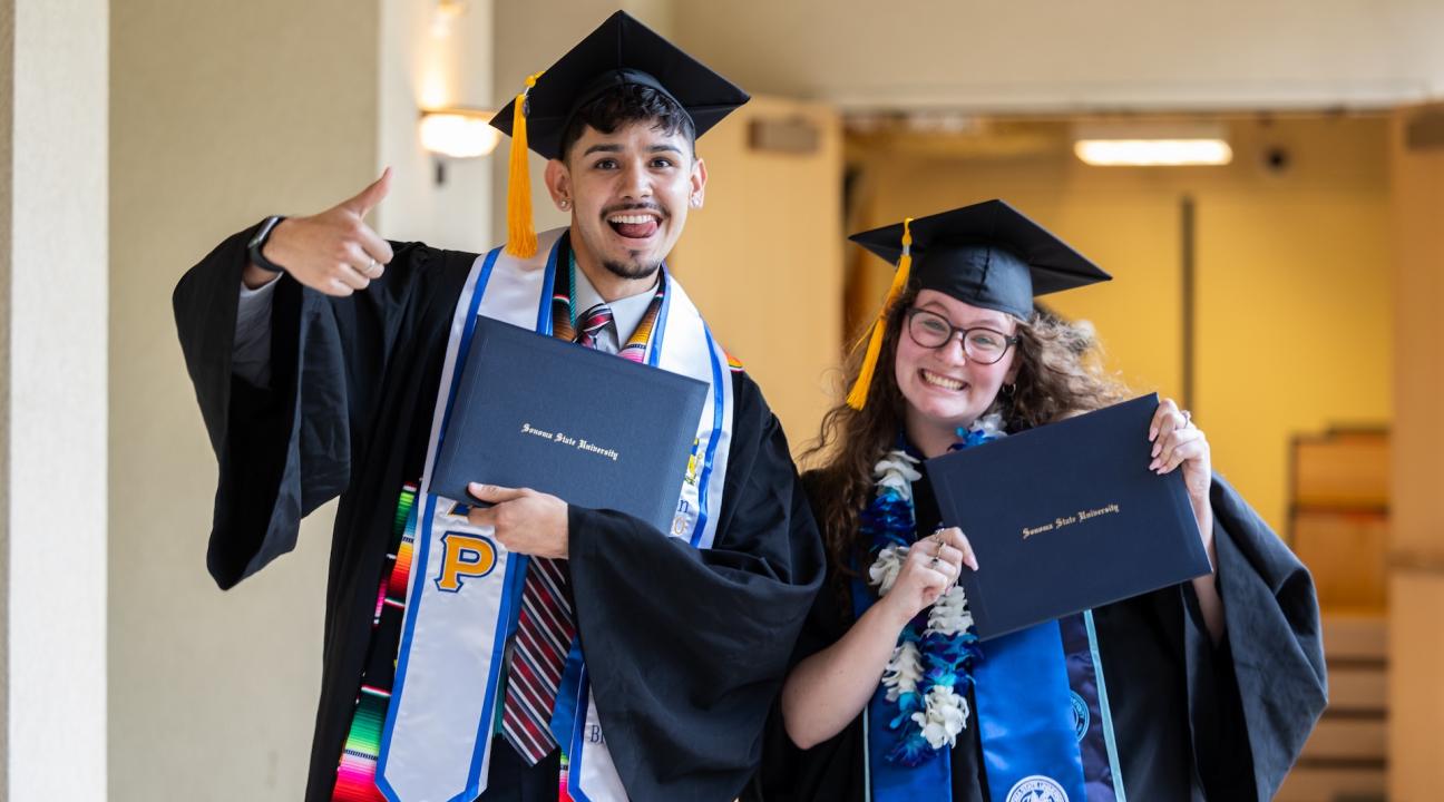 Grads with diplomas 2024