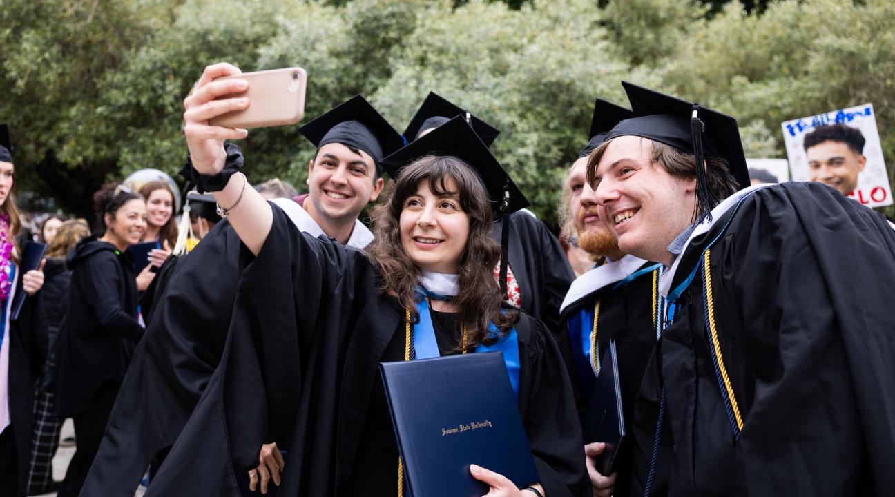 Grads taking selfie