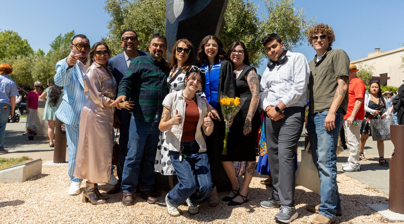 Student with her family outside green music center