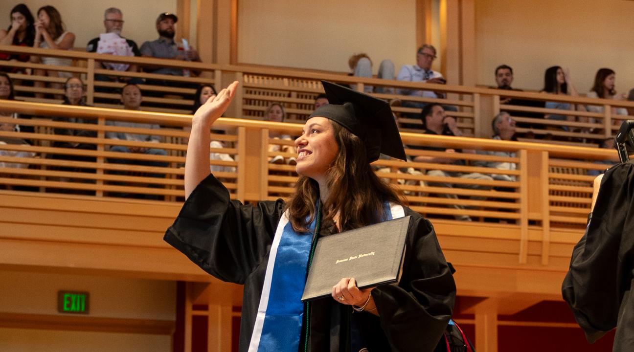 ssu graduate waving from stage
