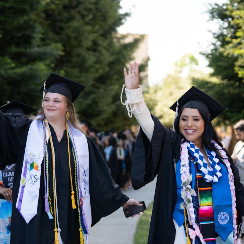 Students waving at their families
