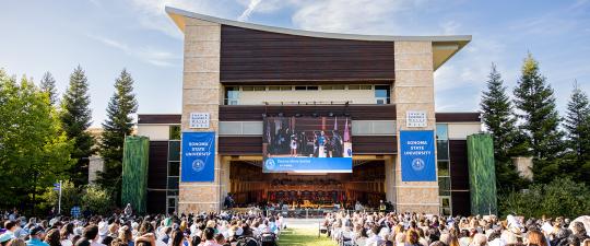 audience outside the Green Music Center at Commencement