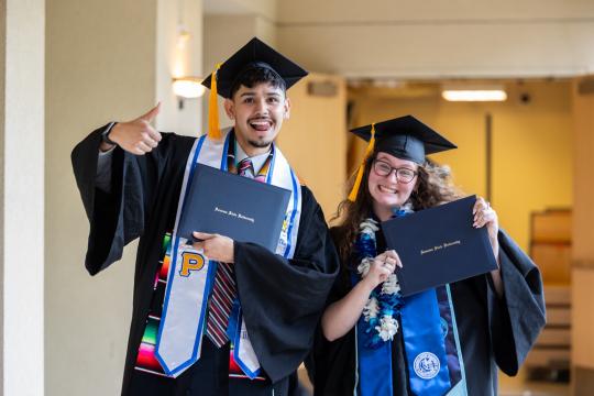 Grads with diplomas 2024