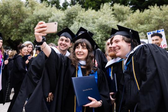 Grads taking selfie