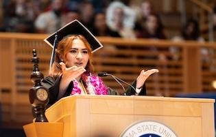 Graduate at podium
