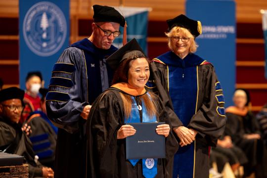 MBA student receiving diploma