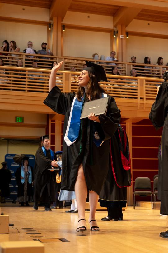 ssu graduate waving from stage