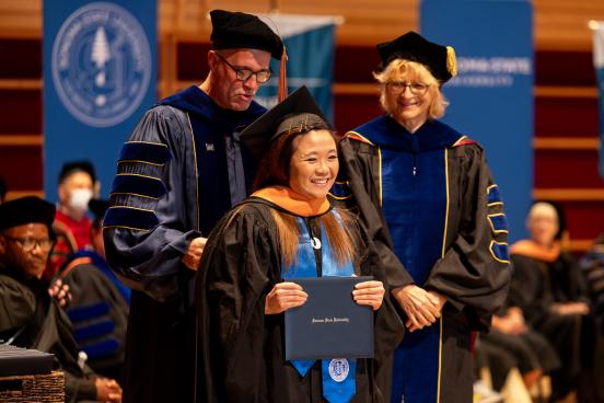 MBA student receiving diploma