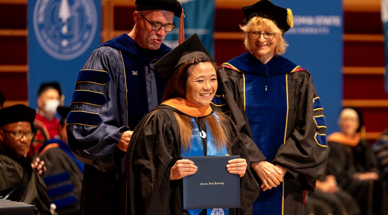 MBA student receiving diploma