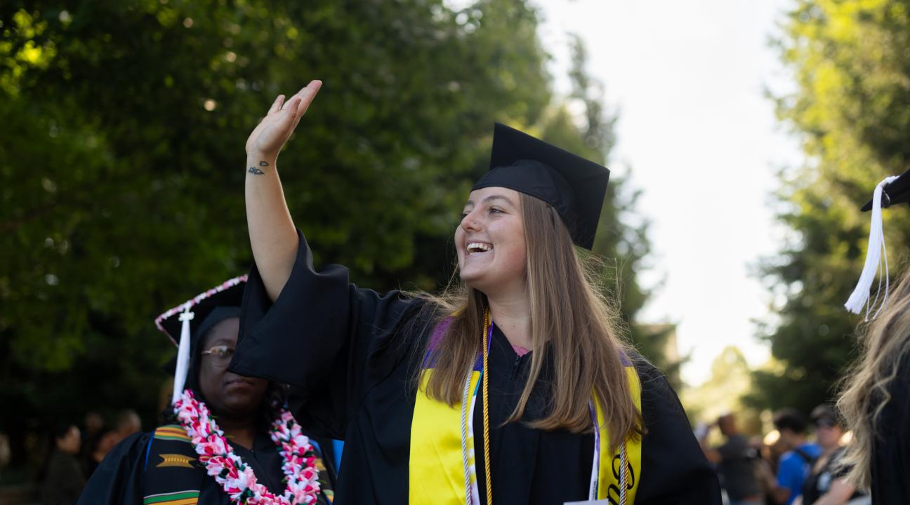 student waving