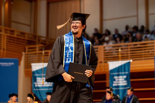 student walking the stage